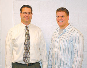 New Bremen's Marcus Overman, right, will play football next fall at the University of Dayton. Marcus' father and high school coach Howard, left, played for Dayton in the 1970s.<br>dailystandard.com