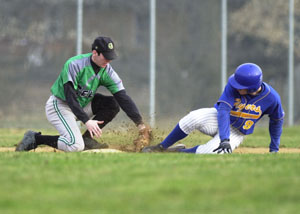 Celina's Eric Braun, left, tags out Marion Local's Troy Luebke, right, during their Mercer County matchup at Eastview Park on Tuesday night. Celina scored a run in the bottom of the seventh inning to post a 4-3 victory over the Flyers.<br>dailystandard.com