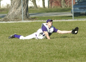 Fort Recovery's Matt Hein makes a diving catch in the outfield during Monday's contest against St. Marys. Fort Recovery defeated St. Marys, 9-3. It's the first loss of the season for the Roughriders.<br>dailystandard.com