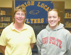 Marion Local basketball star Maria Moeller, right, verbally committed to playing at Ohio State University after her senior season in 2006 on Wednesday. Flyers coach Treva Fortkamp is on the left.<br>dailystandard.com