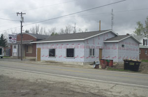 Wendelin Tavern & Grille is taking shape in the wake of a Feb. 26 fire that reduced the original structure at far left to a brick shell. The owner hopes the original building as well as an addition that doubles the size of the business will be ready to open in about a month.<br>dailystandard.com