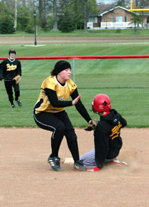 Parkway's Erica Yoder, left, puts a late tag on New Bremen's Megan Sindelar, right, at second base during their Midwest Athletic Conference matchup on Monday. Parkway defeated New Bremen, 7-1.<br>dailystandard.com