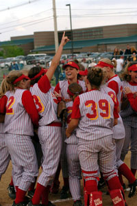 New Bremen softball players celebrate after capturing the first district title in team history with a 2-0 win over Specerville at Wapakoneta on Friday.<br>dailystandard.com