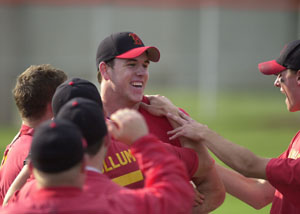 Alex Leguers, center, is swarmed by his New Bremen teammates after throwing a no-hitter to beat Crestview 1-0 and send the Cardinals to the Division IV regional baseball semifinals next week.<br>dailystandard.com