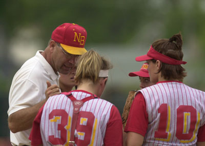 New Bremen head coach Craig Griesdorn, left, talks with his players at the mound during Thursday's Division IV state semifinal contest against top-ranked Crestview at Brookside Park in Ashland. New Bremen's best-ever tournament run came to a halt in the state semifinal as Crestview defeated the Cardinals, 6-1.<br>dailystandard.com