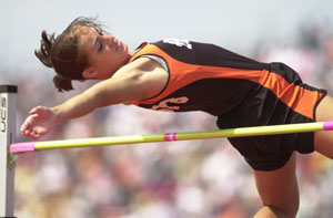Minster's Amy Kremer clears the bar during the high jump competition on Friday at the state track meet in Columbus. Kremer finished fifth in the event.<br>dailystandard.com
