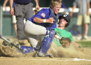 Celina's Jordan Heuker, right, slides safely into home as St. Marys catcher Cullen Flinn, left, tries to block the plate on Tuesday at Eastview Park in ACME action. St. Marys defeated Celina, 13-10.<br>dailystandard.com