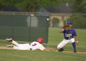 Grand Lake first baseman Michael Ayala takes the throw from a teammate during the Mariners' season opener against Geneva on Tuesday. Ayala had a solo home run and double in the Mariners' 4-0 victory.<br>dailystandard.com