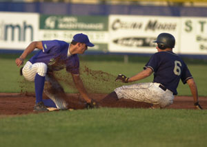 Grand Lake second baseman Scott Boley, left, applies the tag to Lake Erie basestealer Jeff Hehr, 6, during the sixth inning at Jim Hoess Field on Monday night. Grand Lake defeated Lake Erie, 1-0, in the Mariners' Great Lakes Summer Collegiate League opener.<br>dailystandard.com