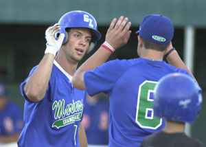 Grand Lake's Kris Moorman gets congratulated after hitting a home run against Lima on Tuesday at Jim Hoess Field. <br>dailystandard.com