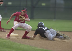 Parkway's Trevor Krogman, right, slides past St. Henry's Jay Woeste, left, to steal second base during their ACME contest on Wednesday at the Wally Post Athletic Complex. Parkway went on to defeat St. Henry, 12-1.<br>dailystandard.com