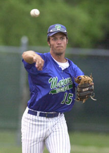 Grand Lake third baseman Kris Moorman fires the ball across the diamond for an out during the Mariners' game against te Ohio Storm on Friday night. The Mariners won the game, 6-2.<br>dailystandard.com