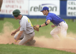 Grand Lake shortstop Bryan Witt, right, tags out a Southern Ohio baserunner during Saturday's doubleheader at Jim Hoess Field at Westview Park. The Mariners improved to 8-3 overall on the summer after sweeping three games over the weekend.<br>dailystandard.com