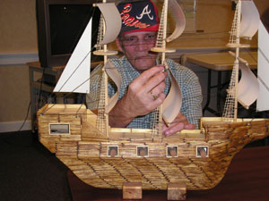 Celina resident Mick Fowler started building ships and lighthouses from matchsticks 20 years ago. The ship above required about 1,800 matchsticks.<br>dailystandard.com