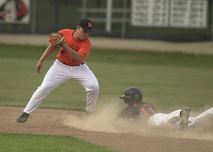 Coldwater's Cory Klenke, right, steals second base in the second inning as Minster shortstop Aaron Heitbrink, left, tries to make the tag during Monday's ACME contest at Veterans Field. Coldwater was leading 4-0 when weather forced the cancellation of the game.<br>dailystandard.com
