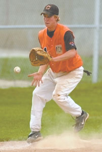 Coldwater's Tyler James fields a ball during the Mercer County ACME sectional tournament at Veterans Field in Coldwater on Friday. James had two hits to help the Cavaliers to a 7-1 win over Parkway to claim the sectional title.<br>dailystandard.com