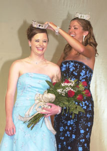 Two Fort Recovery queens graced the stage at the conclusion of Monday night's Miss Lake Festival scholarship pageant. Newly crowned queen Sarah Garman is crowned by outgoing queen Marisa Minor.<br>dailystandard.com