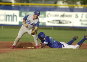 Grand Lake's Ben Gaal, right, slides safely into second base for a double during the first inning of their game against Delaware at Jim Hoess Field on Thursday night. The Mariners came up short for the fifth consecutive time losing to the Cows, 3-2.<br>dailystandard.com