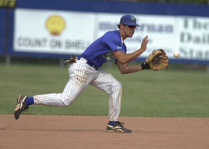 Grand Lake shortstop Bryant Witt gets in position to make a play on a groundball during the Mariners' first game of a doubleheader against Indianapolis on Tuesday night. The Mariners qualified for the postseason by sweeping the Servants, 4-2 and 4-1.<br>dailystandard.com