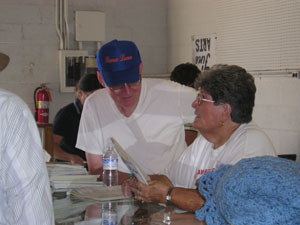 Cora Kettler, fair board member and director of the fine arts department, spent Sunday afternoon signing in creative arts entries at the Auglaize County Fair, which begins today and runs through Saturday. Her husband Louie helps her with the task. <br>dailystandard.com