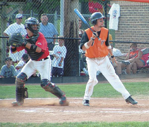 Coldwater's Trevor Stromblad, 7, watches as Bellefontaine catcher Josh Cronkleton, left, throws to second base in an attempt to throw out Cory Klenke.<br>dailystandard.com