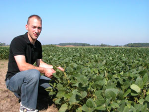Joe Grilliot pauses near his father's soybean field in rural Versailles as he talks about his choice to become a Catholic priest. Grilliot, 23, is studying with the Missionaries of the Precious Blood.<br>dailystandard.com