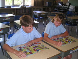 Nick Wilker and Brittany Henning, eighth graders at Holy Rosary School in St. Marys, didn't like the idea of uniforms when they first heard about it this summer, but now find that wearing uniforms is not a big deal.<br>dailystandard.com