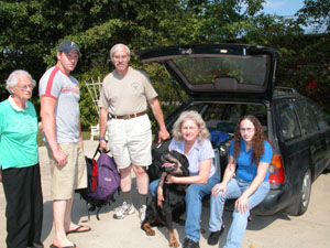 The Massarini family of Louisiana unload a few items they grabbed as they fled Hurricane Katrina's path more than a week ago. The group gradually made their way north and currently are staying with relatives in Montezuma. Pictured is Jean Dewey, left, of New Orleans, with her daughter's family, Ricky, Rick, Barbara and Jennifer Massarini of Westwego, La., and one of the family's three dogs.<br>dailystandard.com