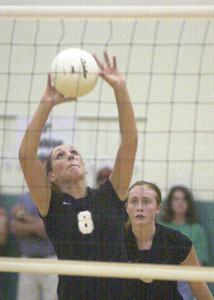 Celina's Kylie Dorsten, 8, passes the ball to a teammate as Betsy Hone, back, looks on. Celina defeated Van Wert on Thursday in three games.<br>dailystandard.com