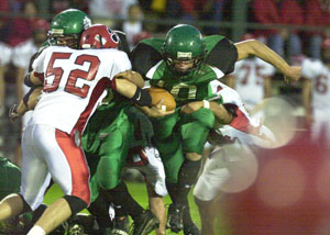 Celina's Erik Chapin, with ball, runs through the middle of the Kenton defense for a small gain during their game on Friday night at Celina Stadium. Chapin scored three rushing touchdowns, but it wasn't enough as Kenton defeated Celina, 41-29.<br></br>dailystandard.com