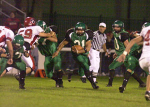 Celina's Andy Harner, 31, runs through a big hole during last Friday's loss to Kenton at Celina Stadium. Celina will be looking for its first home win on Friday when Elida comes to town for a Western Buckeye League encounter.<br></br>dailystandard.com