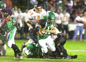 Celina's Brandon Ley, 47, drags an Elida ball carrier during Friday's game against Elida at Celina Stadium. Elida defeated Celina, 41-24.<br></br>dailystandard.com