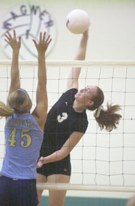 Celina's Betsy Hone, 3, spikes a ball past Bath's Alex Dackin, 45, during their Western Buckeye League volleyball match on Tuesday night. Celina defeated Bath in three games to remain undefeated on the season in league play.<br></br>dailystandard.com