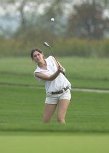 Celina's Emily Stolly chips the ball onto the green during Tuesday morning's sectional girl's golf tournament which was played at The Fox's Den. Stolly fired a 103 to help Celina finish third and qualified for the district tournament.<br></br>dailystandard.com