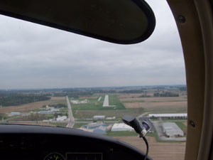 Flying with Mark Heinel gives passengers a bird's eye view of Lakefield Airport and the intersection of state Routes 219 and U.S. 127 during the third annual Chili Fly-in on Saturday. Plane rides were part of the fly-in activities.<br></br>dailystandard.com