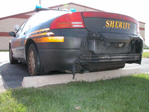 An Auglaize County Sheriff's cruiser exhibits rear-end damage from a high-speed pursuit early Friday morning. During the chase, the Dodge Intrepid bottomed out and erupted into flames after going airborne. Although the vehicle being pursued temporarily got away, the driver, Sam Schoch of Celina, was apprehended later that day.<br></br>dailystandard.com