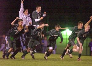 Celina players react after Aaron Schmitt's penalty kick gave the Bulldogs the win over Bowling Green in the Division I sectional tournament game held at Graham Stadium in Findlay on Monday night.<br></br>dailystandard.com