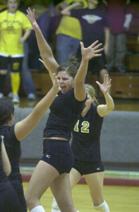 Parkway's Rebekah Roehm, middle, celebrates with teammates after the Panthers defeated Coldwater in the Division III district semifinals. Parkway won the match in five games.<br></br>dailystandard.com