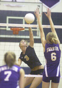 Parkway's Laura Ar, 3, hits the ball past Swanton's Jessica Fowler, right, during their Division III district final contest at Napoleon High School on Saturday. Parkway won the district title with a three-game victory over Swanton.<br></br>dailystandard.com