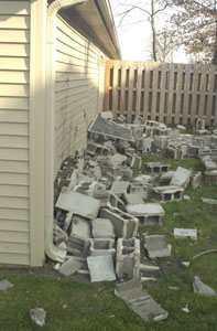 Concrete block damaged the interior and exterior of the Leo Koesters' home at 1724 Settlers Lane. No one was injured in the collapse of the wall.<br></br>dailystandard.com