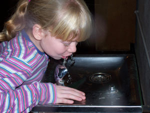 Katlin Robinson, a fifth-grader at Immaculate Conception School in Celina, takes a drink at the water fountain. Celina City Council has been working for years on ways to improve the quality of Celina drinking water.<br></br>dailystandard.com