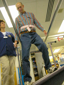 Granville Township Trustee Terry Nieport of St. Henry exercises on a wave board under the watchful eye of physical therapy assistant Lori Likens at Mercer County Community Hospital in Coldwater. Nieport continues to recuperate after a procedure to repair an aneurysm at the base of his brain.<br></br>dailystandard.com