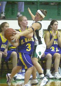Celina's Amy Harner, right, applies defensive pressure to St. Marys' Toya Anderson, 3, during their game on Thursday night at the Fieldhouse. Celina won the game, 34-33.<br></br>dailystandard.com