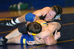 Celina's Jordan Davis, clamps down on St. Marys' Jacob Bryant in the 160-pound bout of Thursday's match at St. Marys. Davis scored a 10-1 major decision.<br></br>dailystandard.com