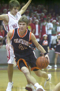 Coldwater's Brady Geier drives past a Van Wert defender. Geier had 12 points as Coldwater opened its delayed season.<br></br>dailystandard.com