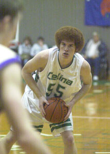 Celina's Justin Chapel looks for an open teammate during the semifinals of the HALLiday Shootout on Tuesday night at the Fieldhouse. Chapel scored nine points and had seven rebounds in the Bulldogs' 58-38 victory over Bryan.<br></br>dailystandard.com