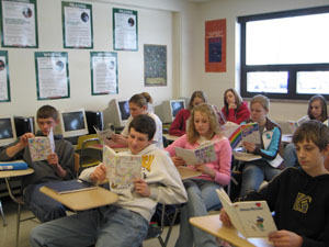 Sophomores at Marion Local High School in Maria Stein give the books they wrote one final read before sending them off to children in war-torn northern Uganda. The English II project yielded 97 books ranging from stories of missing bananas to waddling penguins.<br></br>dailystandard.com