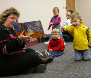 Paula<br></br>Drummond, youth service coordinator at the St. Marys Community Public Library, gets an excited reaction from Ty Kiehl of St. Marys as she reads to the youngsters during toddler storytime Thursday morning.<br></br>dailystandard.com