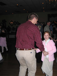 Leanna Wolters of Coldwater laughs with delight while sharing a dance with dad (Roger Wolters), her date for the night. They were among some 450 people attending a Daddy and Me event Sunday night at Romer's Entertainment Facility in St. Henry.<br></br>dailystandard.com