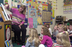 Coldwater kindergarten teacher Kay Bruggeman works with her students. Bruggeman and the district's other kindergarten teachers told school board members Tuesday night they support a switch to all-day, everyday kindergarten.<br></br>dailystandard.com